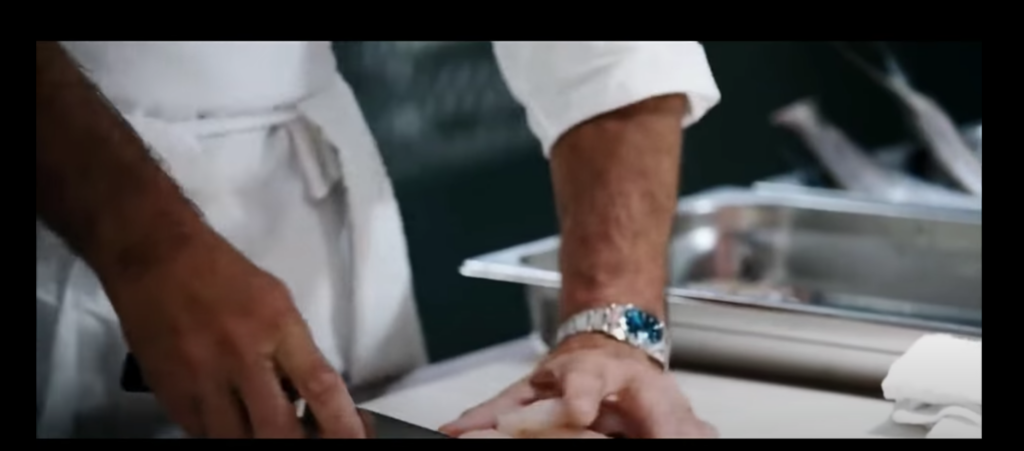 Anthony Bourdain is spotted wearing the Rolex Datejust watch with a blue dial.